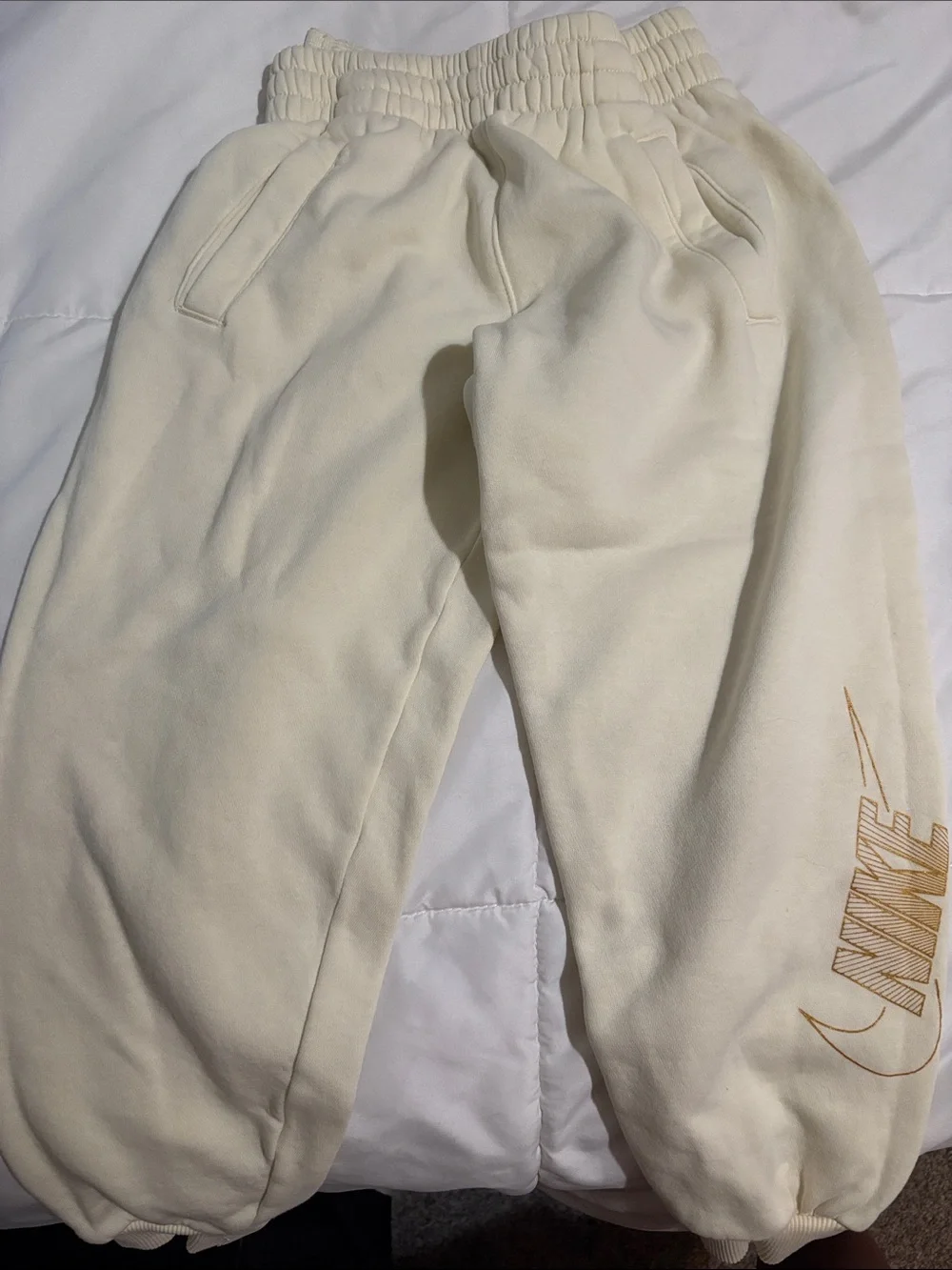 Nike Cream Sweatpants with Gold Logo Accent